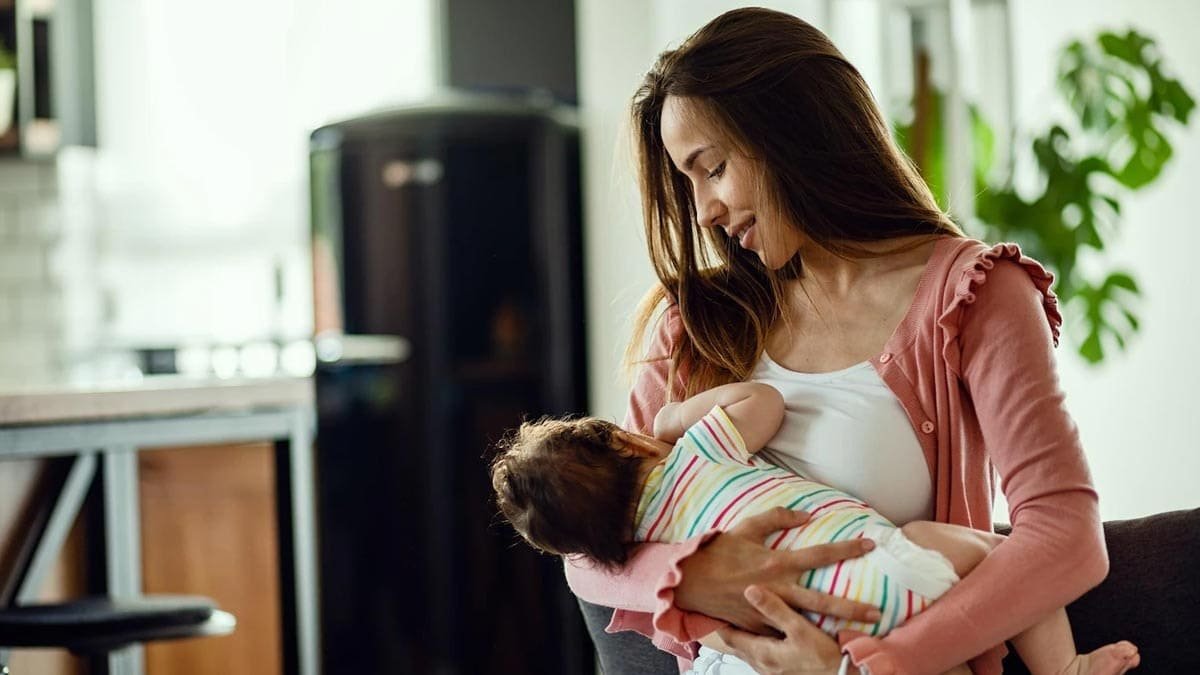 A mother breastfeeding her baby